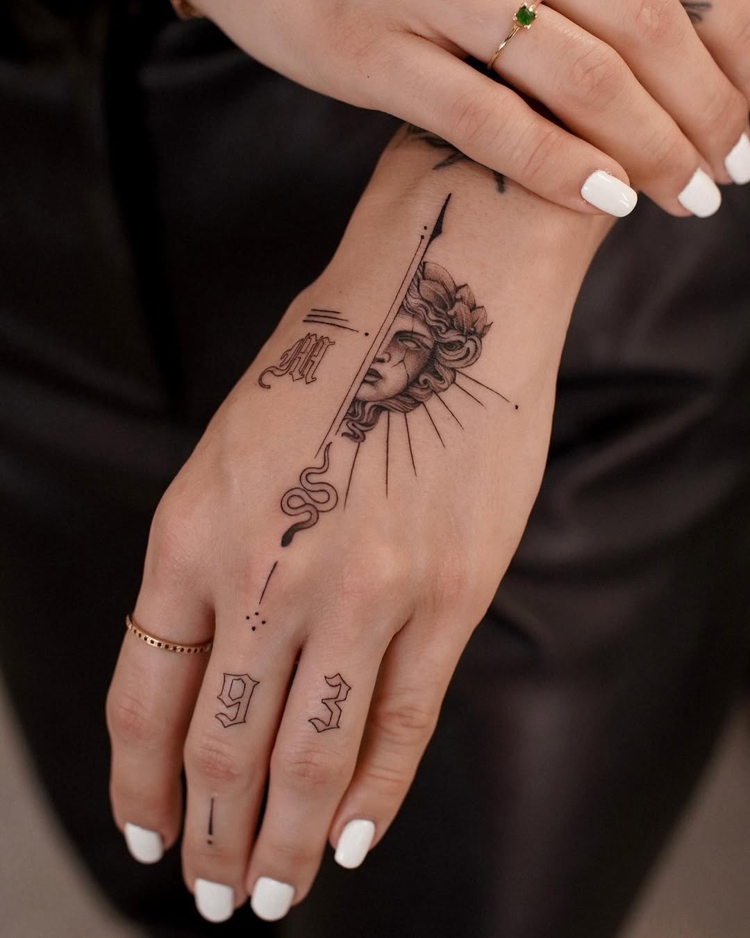Intricate Medusa Tattoo with Sun Elements Tattoo on skin