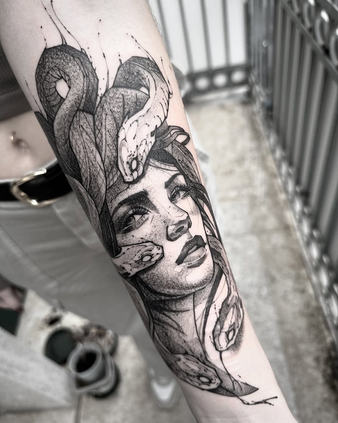 Striking Medusa-Inspired Tattoo with Serpents Tattoo on skin