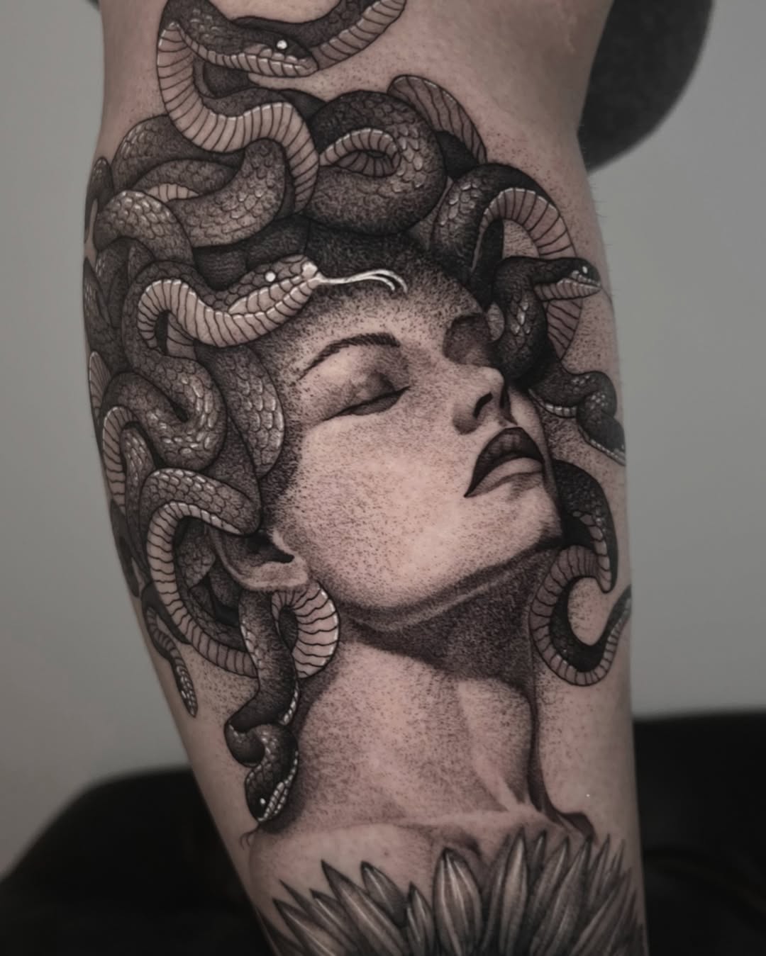 Striking Medusa Tattoo with Intricate Snake Details Tattoo on skin