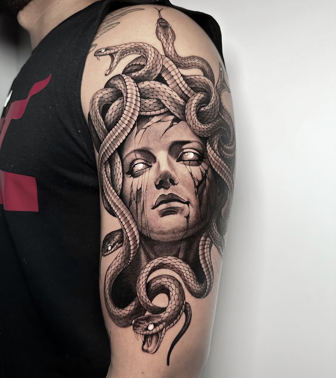 Striking Medusa Tattoo with Intricate Snake Details Tattoo on skin