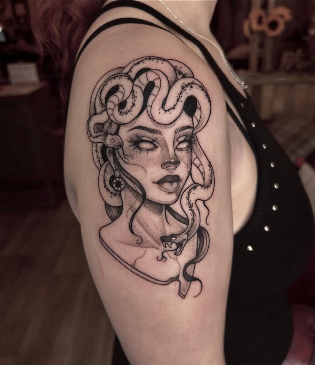 Stunning Medusa Tattoo with Serpentine Details Tattoo on skin