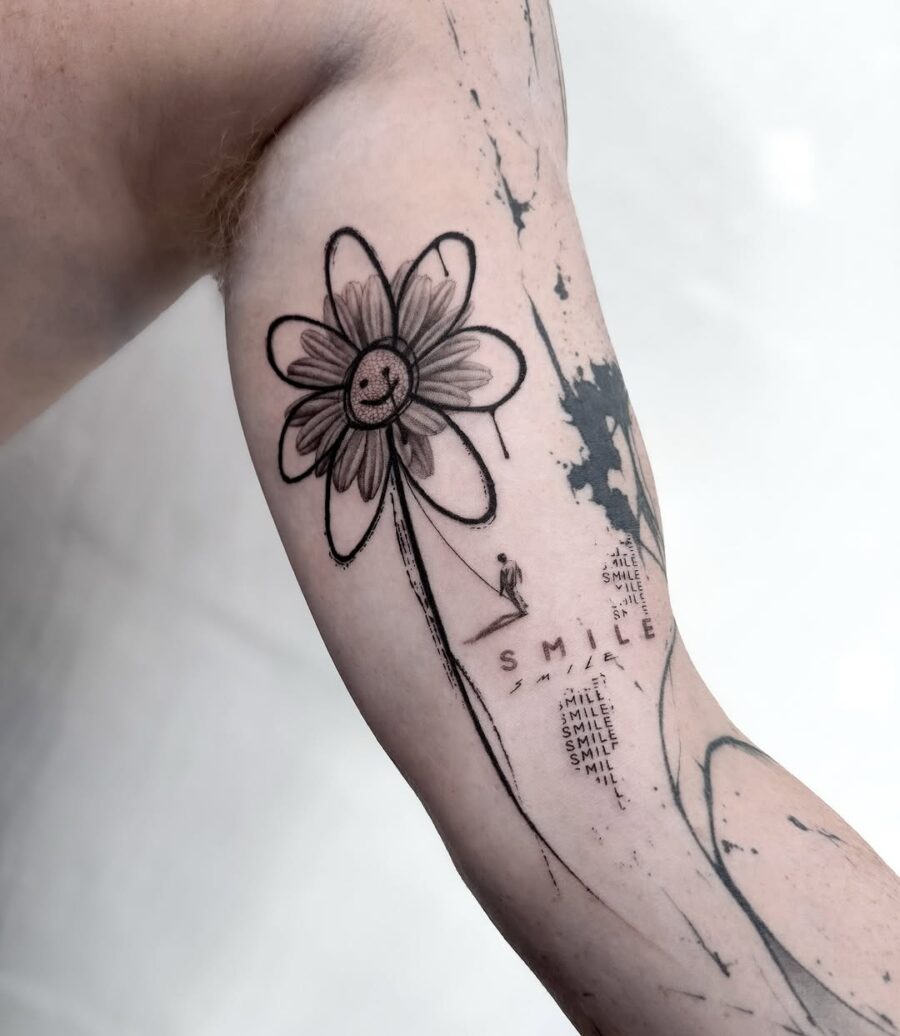 A cheerful flower tattoo with a smile symbol Tattoo on skin