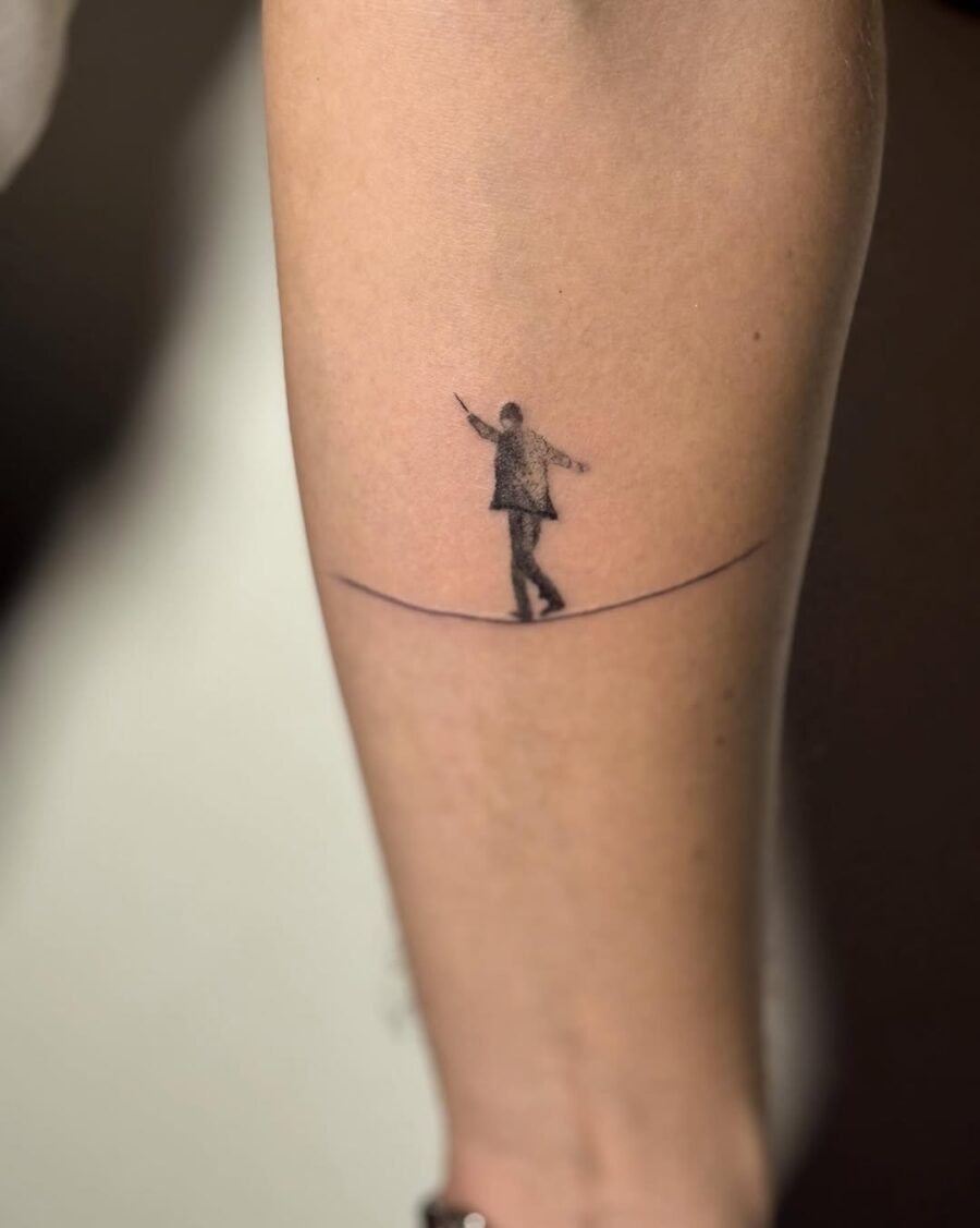 A minimalist tattoo symbolizing balance and mindfulness. Tattoo on skin