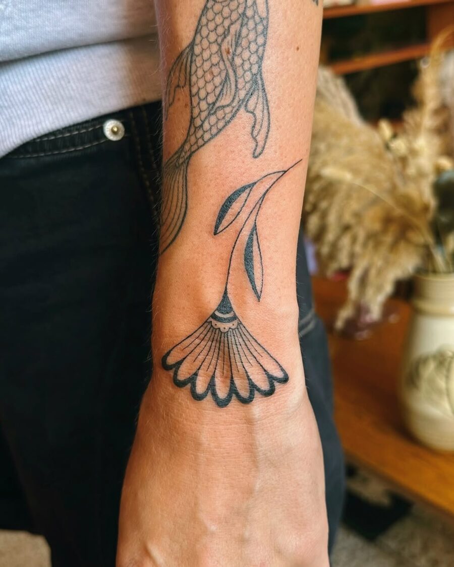 Delicate flower tattoo with mindful symbolism Tattoo on skin