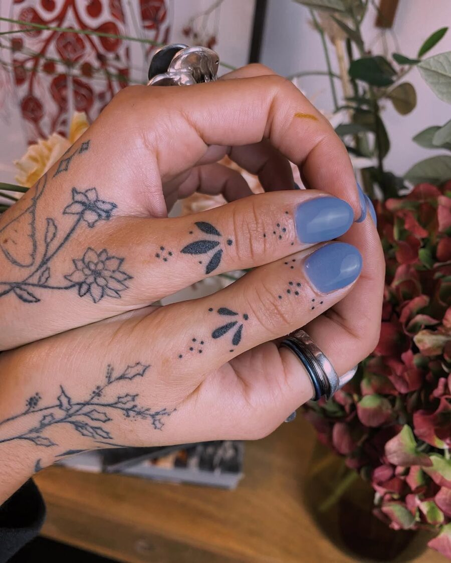 Delicate flowers symbolize tranquility and mindfulness. Tattoo on skin