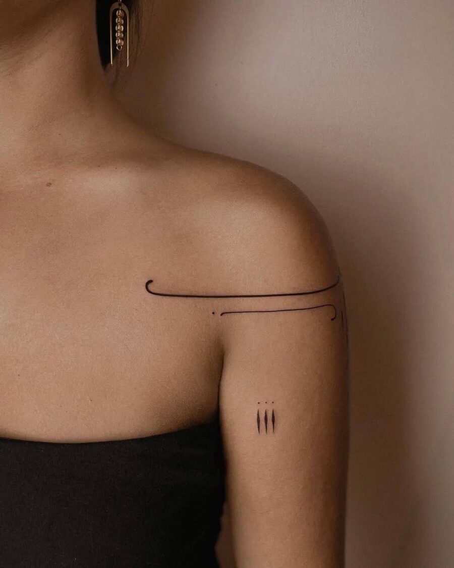 Elegant lines embodying mindfulness and simplicity Tattoo on skin