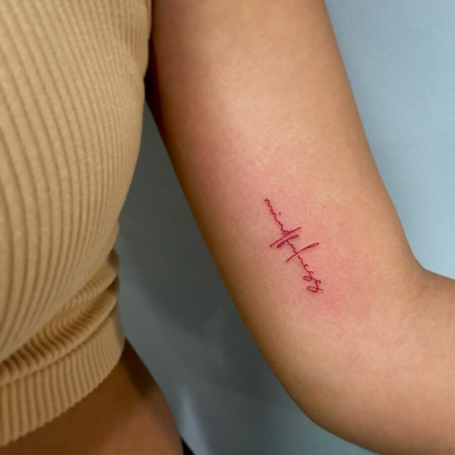 Elegant mindfulness tattoo in minimalist script Tattoo on skin