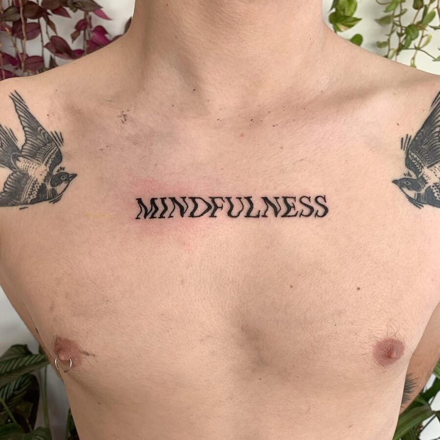 Elegant minimalist mindfulness tattoo on chest Tattoo on skin