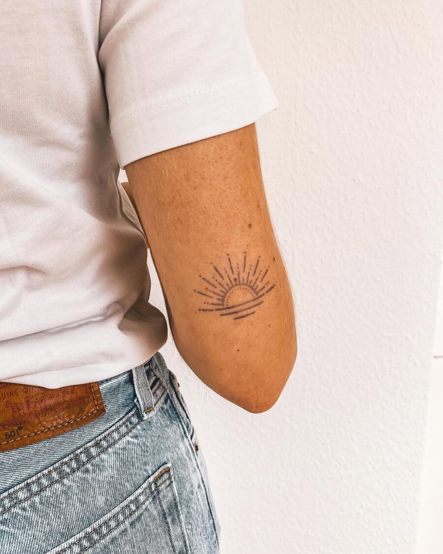 Sunrise tattoo symbolizing positivity and mindfulness Tattoo on skin