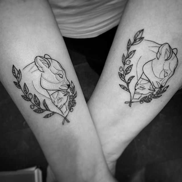 Asymmetrical Lioness & Cub Encircled by Laurels mother daughter tattoos