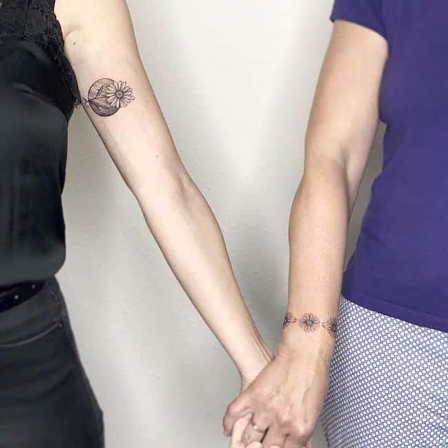 Complementing Black & White Flower Arm Tattoos Tattoo on skin