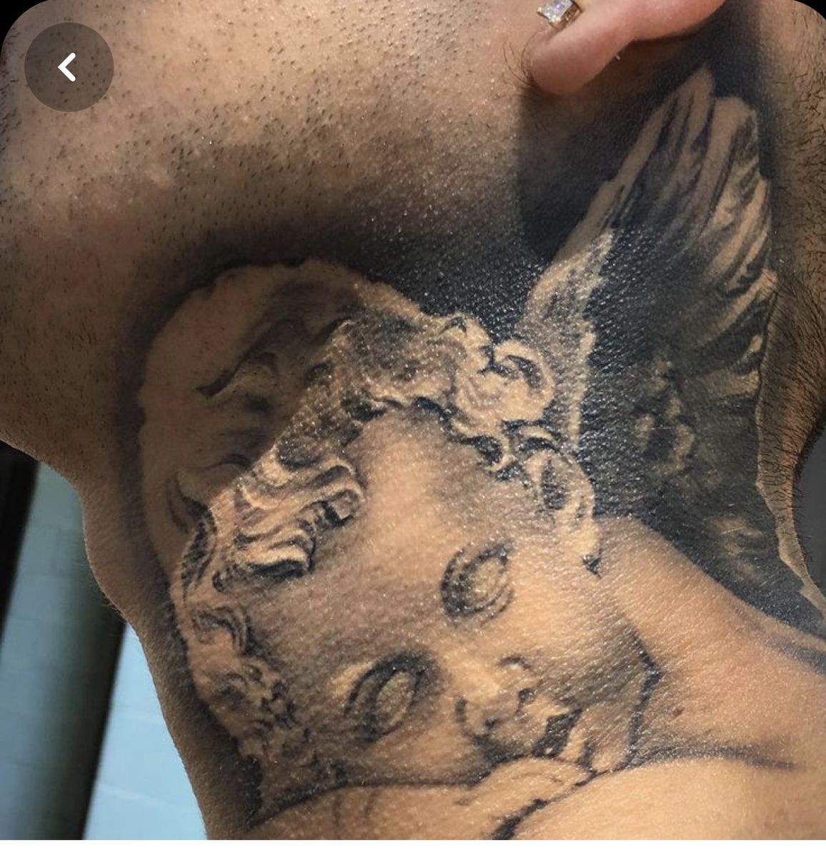 An Eerie Blank Eyed Angel Neck Tattoo Ideas Tattoo on skin