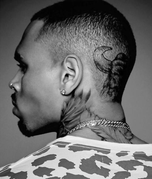 Chris Brown's Feathers from Behind Neck Tattoo Tattoo on skin