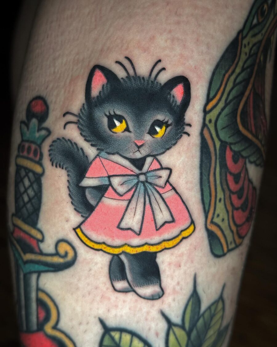 Adorable neo-traditional kitten in pink dress Tattoo on skin