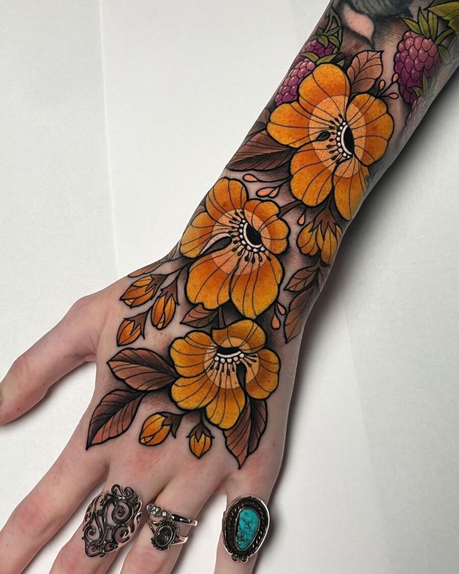 Bold and colorful floral hand tattoo design Tattoo on skin