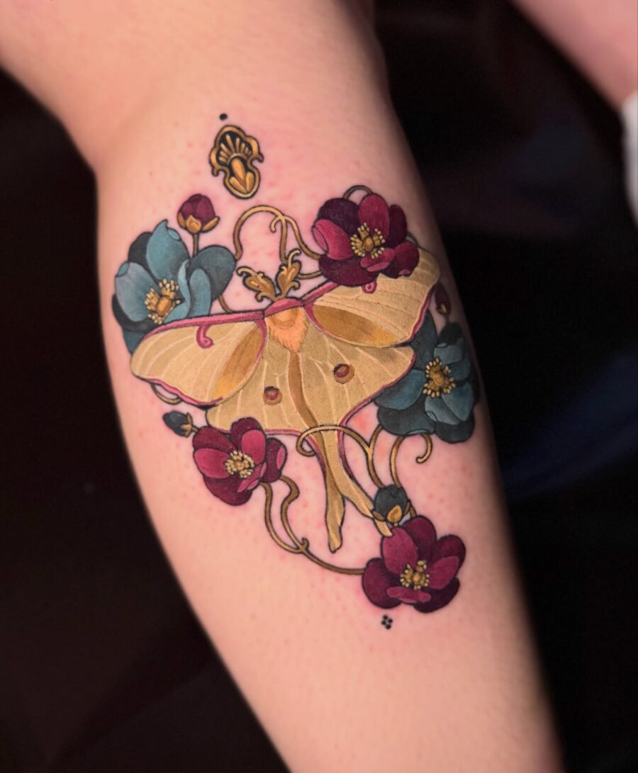 Elegant butterfly surrounded by vibrant flowers Tattoo on skin
