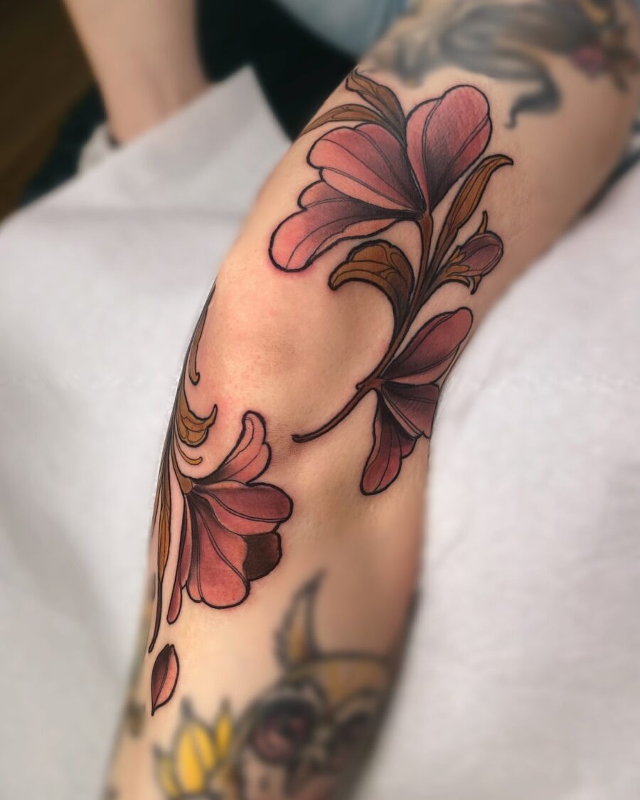 Elegant flora with vibrant neo-traditional style Tattoo on skin