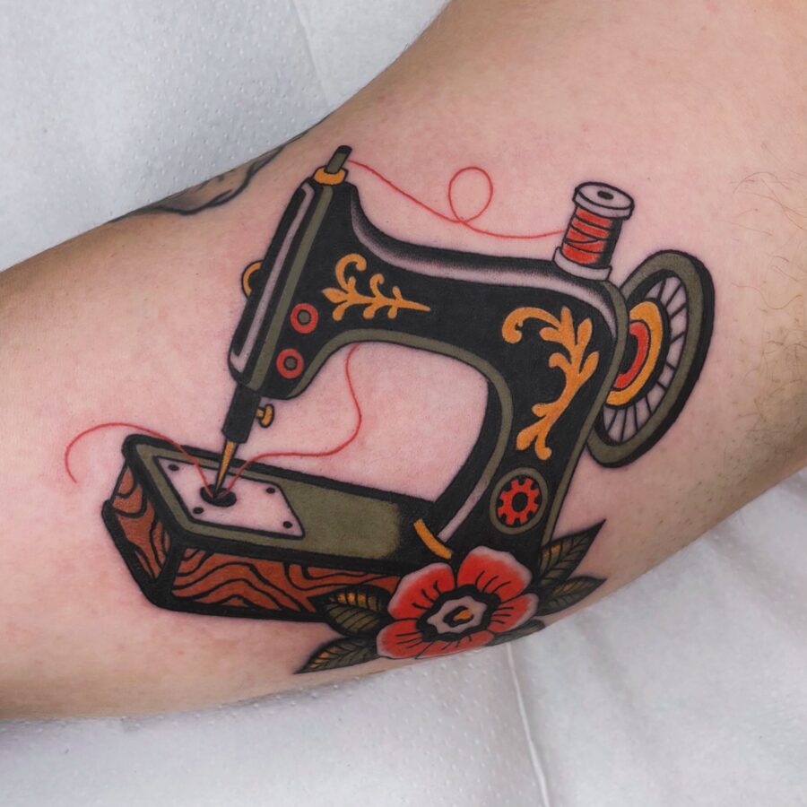 Elegant sewing machine tattoo in neo-traditional style Tattoo on skin