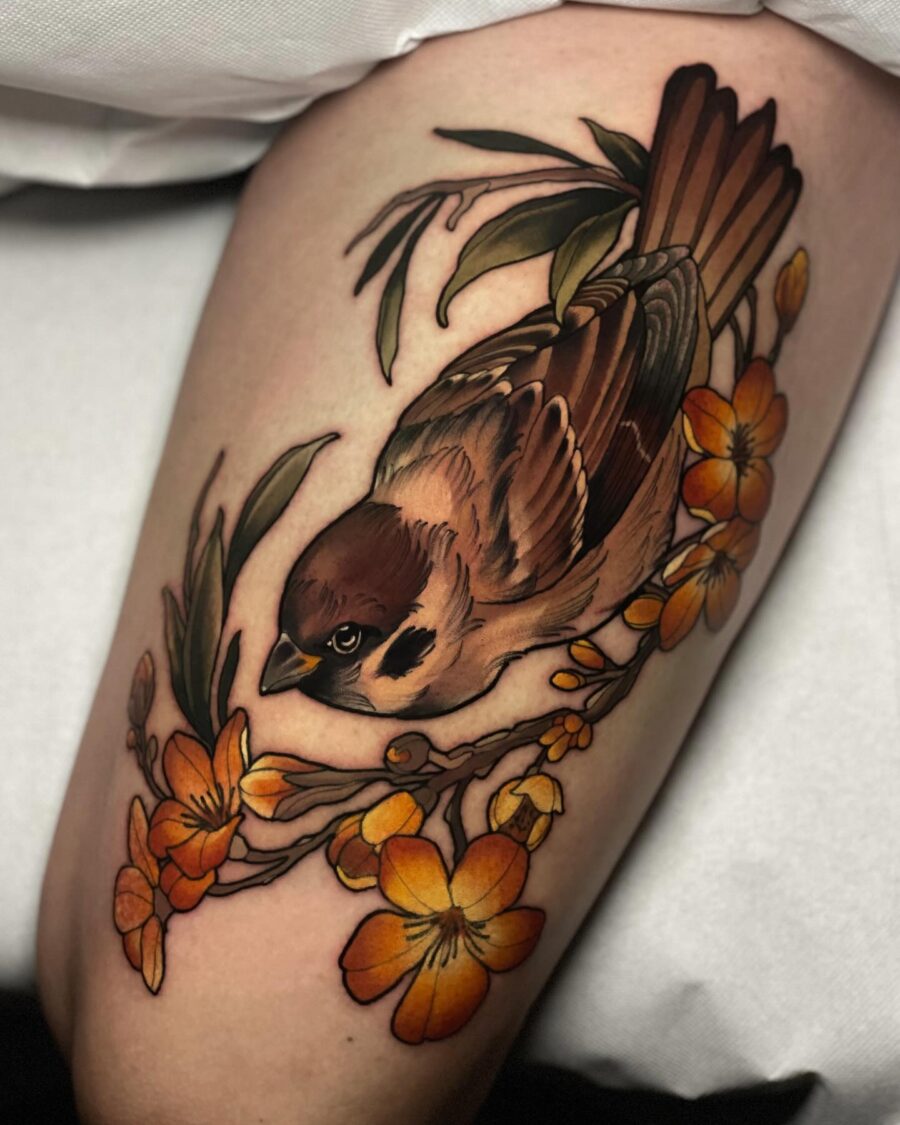 Vibrant bird among beautiful floral accents Tattoo on skin