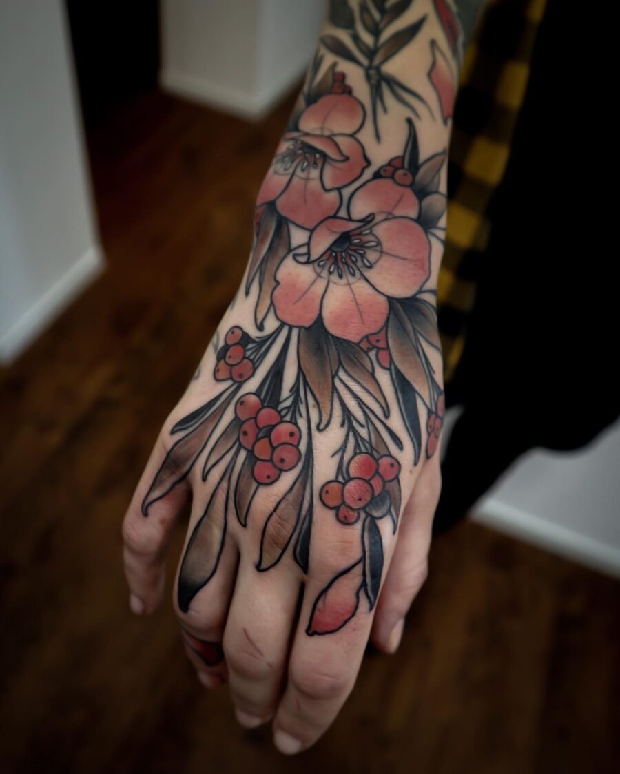 Vibrant floral neo traditional hand tattoo Tattoo on skin