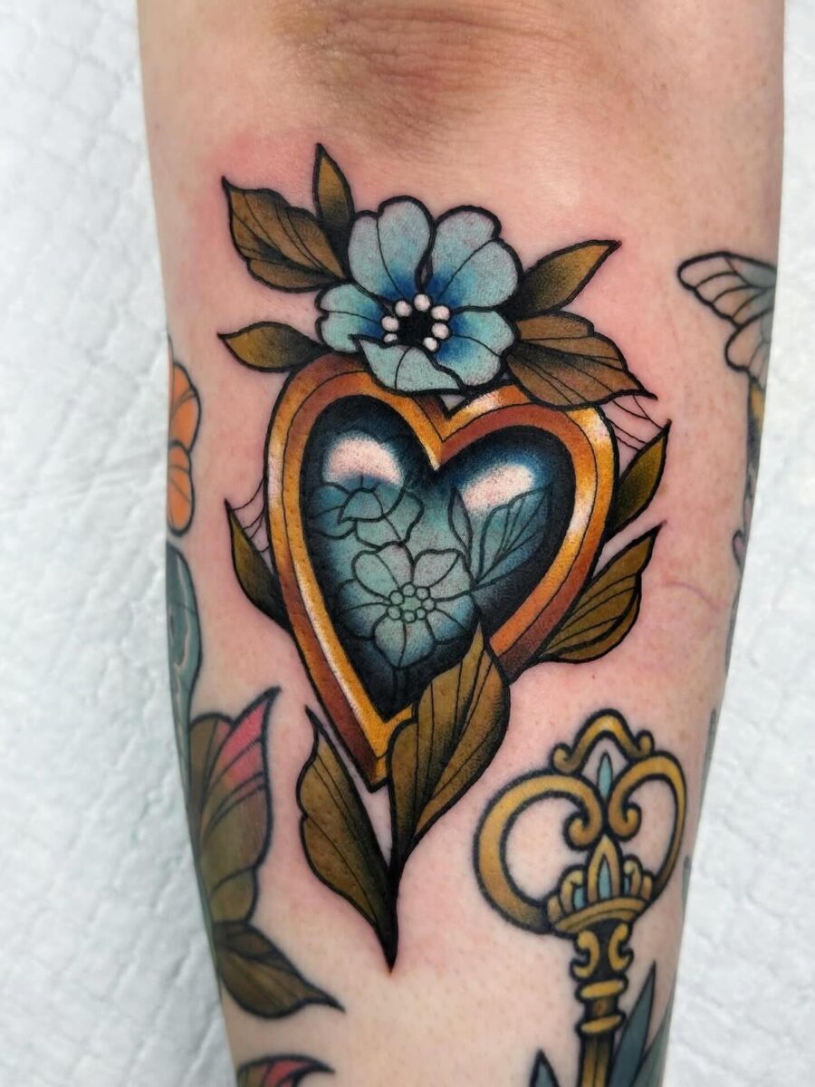 Vibrant neo-traditional heart-shaped tattoo design Tattoo on skin