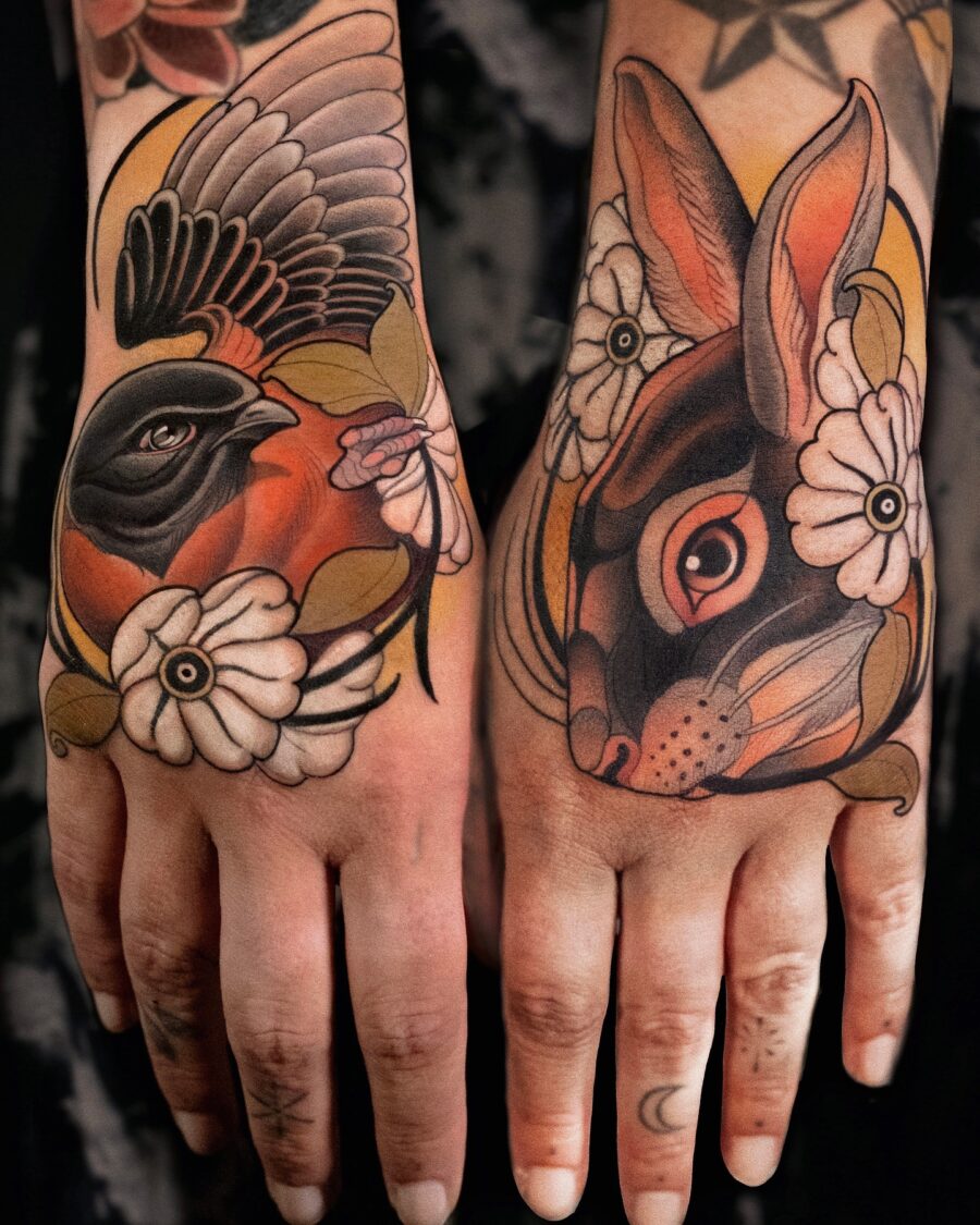 Vibrant neo-traditional tattoo featuring a bird and rabbit Tattoo on skin