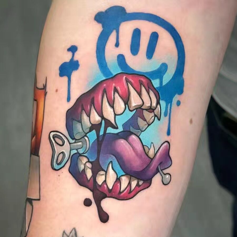 Bold graphic tattoo with playful cartoon elements Tattoo on skin