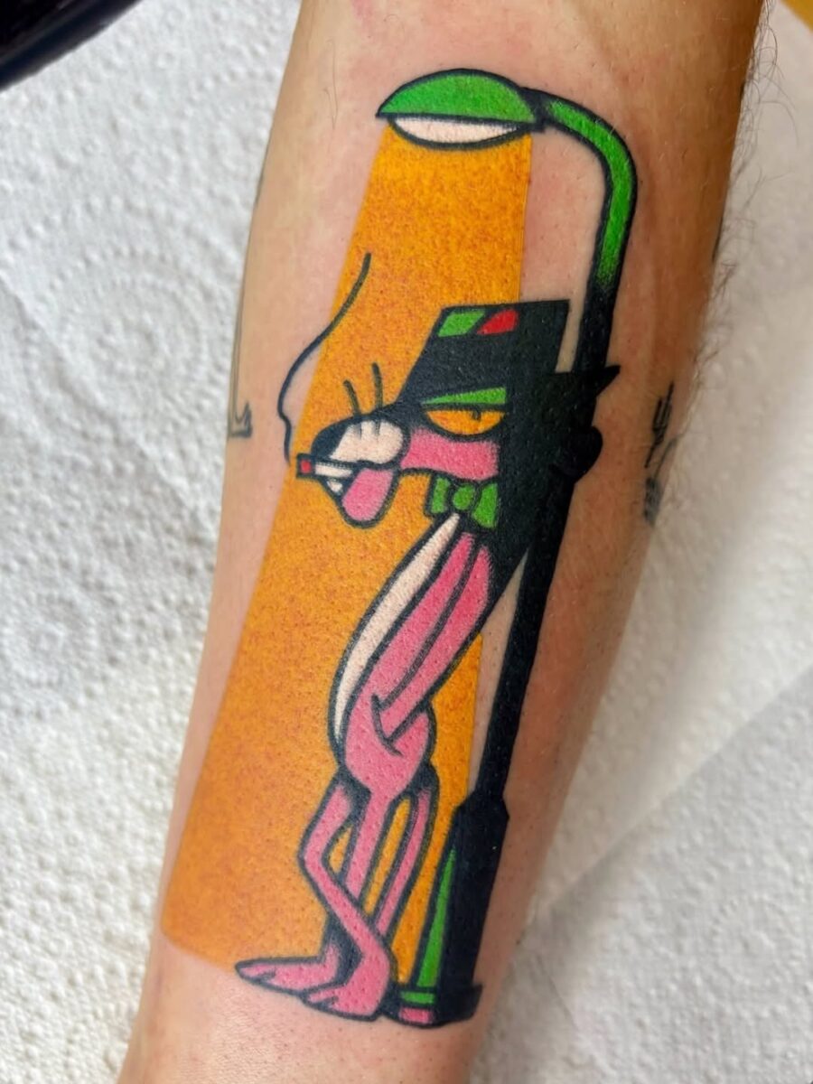 Playful Pink Panther Under Streetlight Tattoo Tattoo on skin
