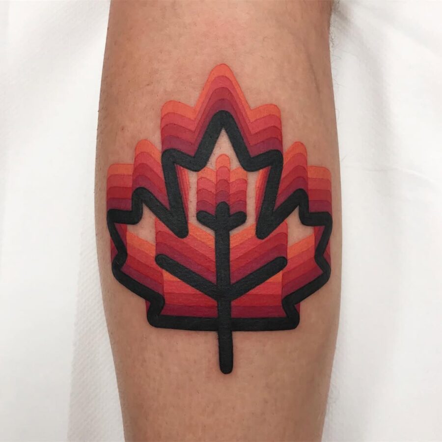 Vibrant geometric leaf tattoo with colored layers Tattoo on skin