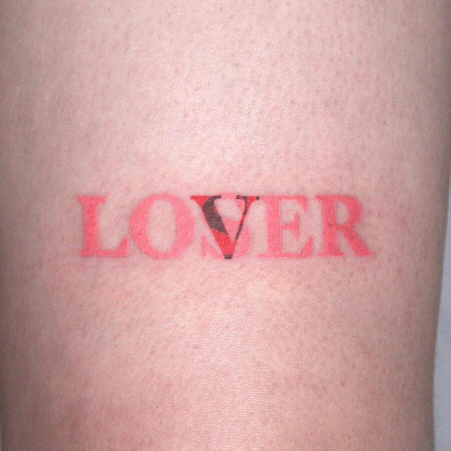 Stylish one-word tattoo of 'LOVER' Tattoo on skin