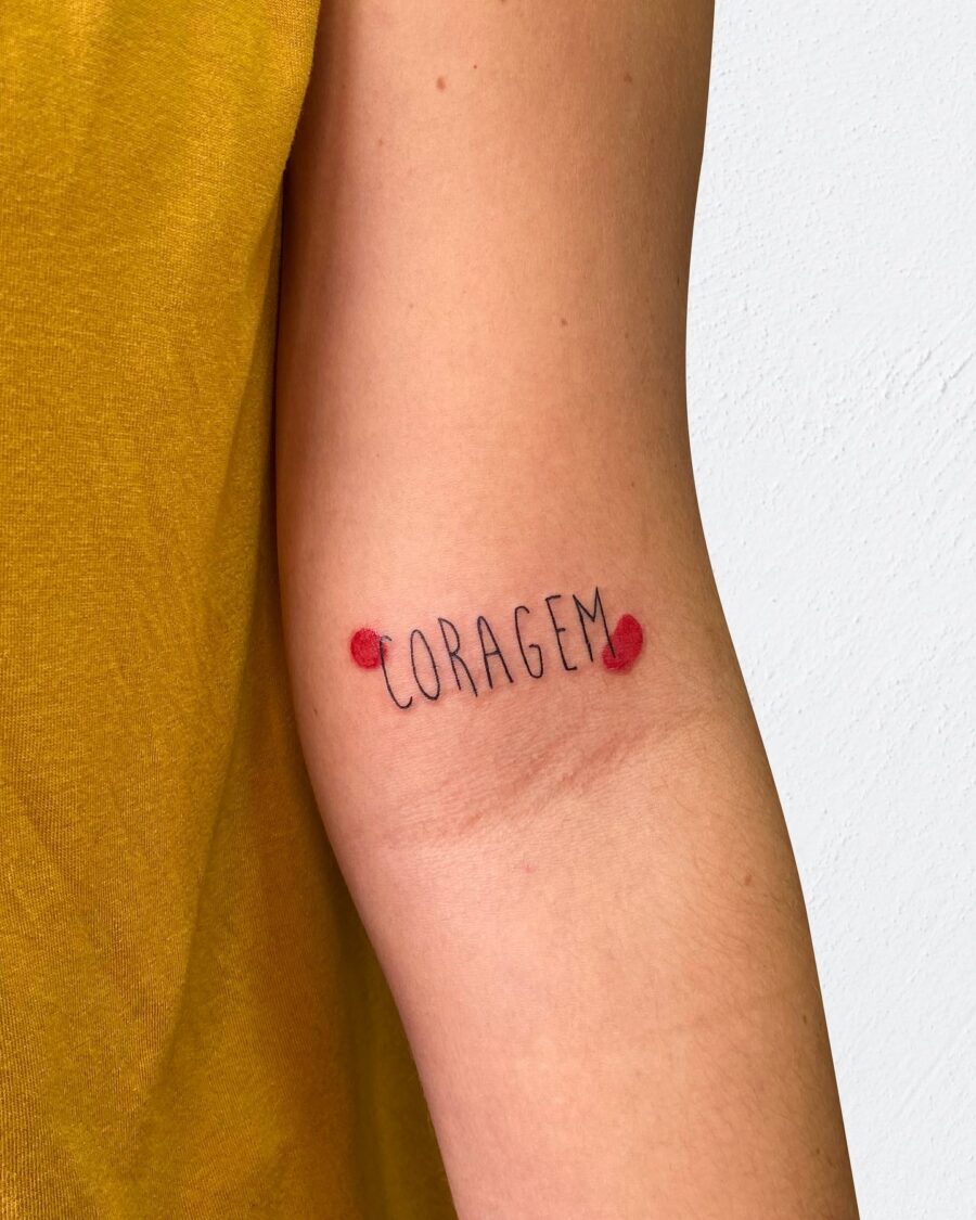 Courage tattoo in a minimalist style Tattoo on skin