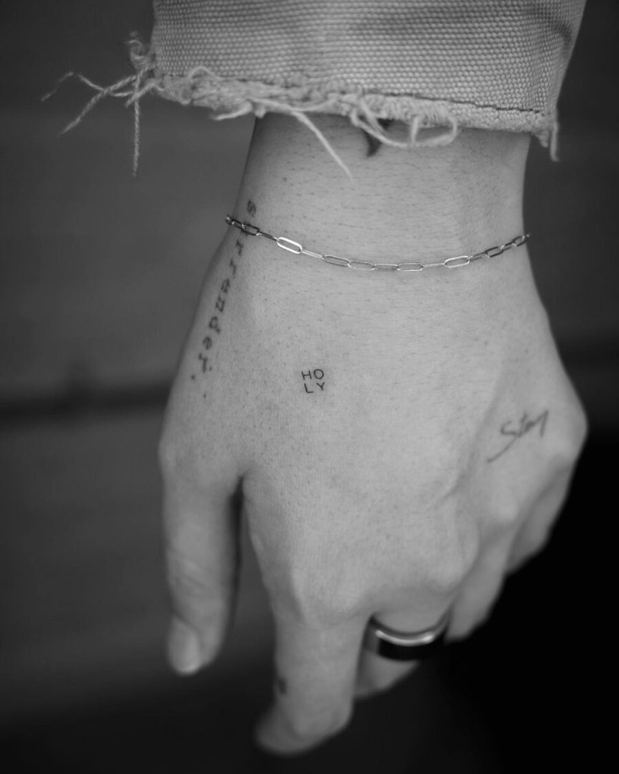 Elegant one-word tattoo in minimal style one word tattoos