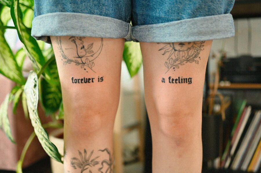 Expressive one-word tattoos on the thighs Tattoo on skin