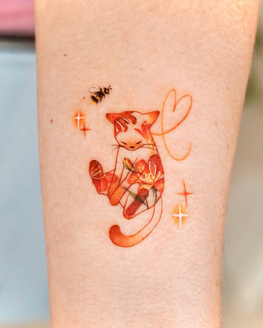 Adorable orange cat tattoo with floral accents Tattoo on skin