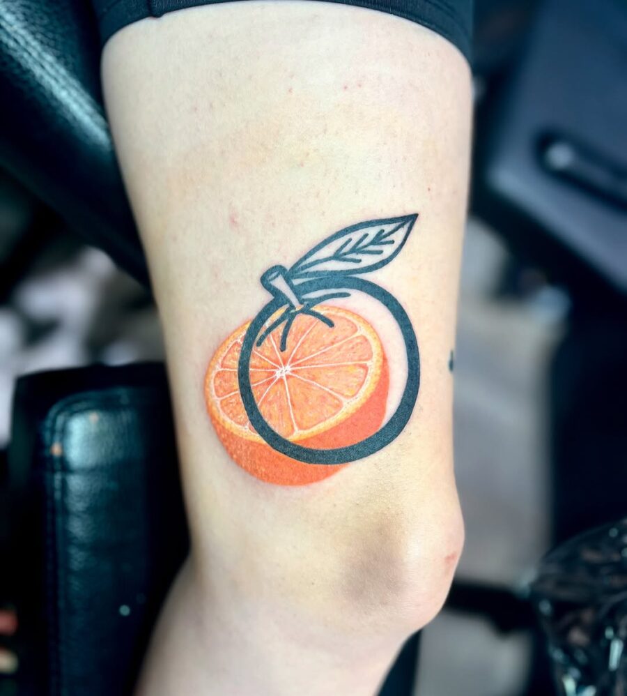 Bright orange tattoo with bold black outline Tattoo on skin