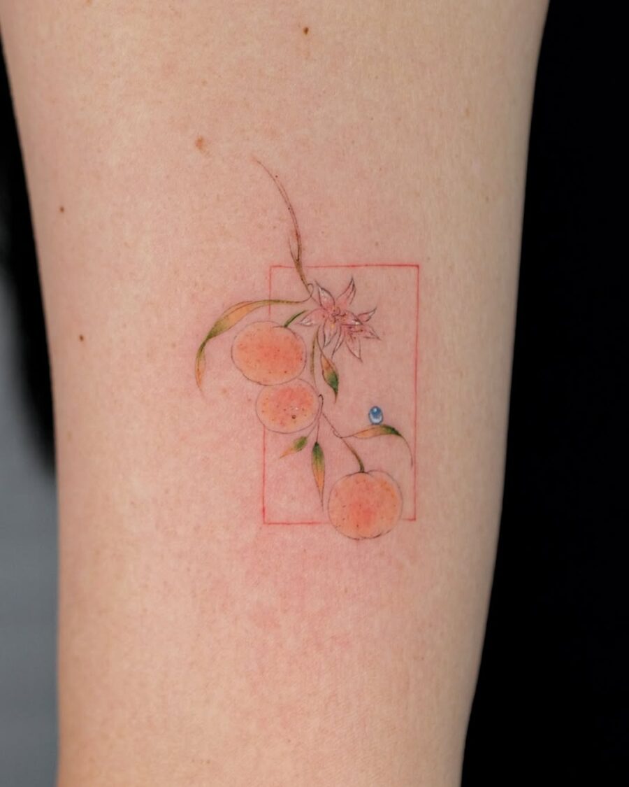 Charming orange tattoo with floral accents Tattoo on skin