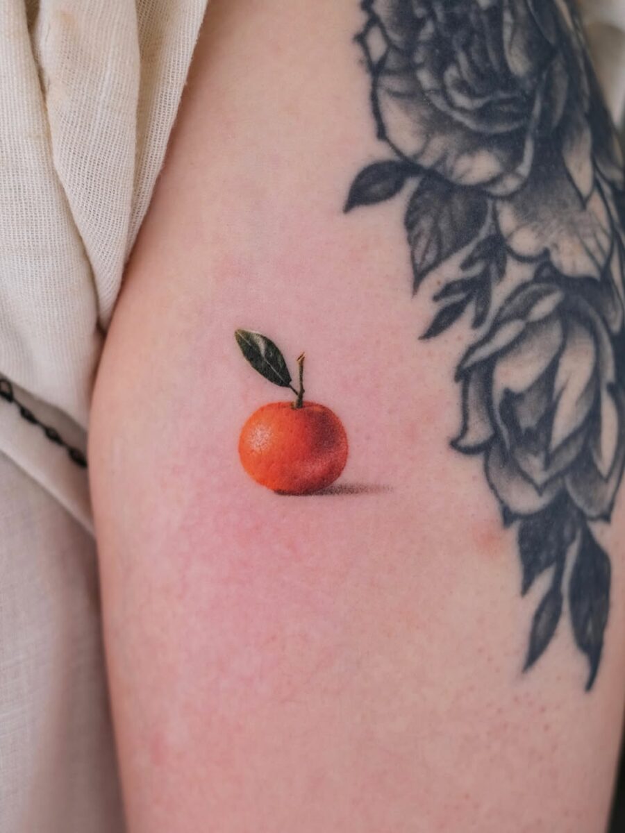 Stunning realistic orange tattoo on skin Tattoo on skin