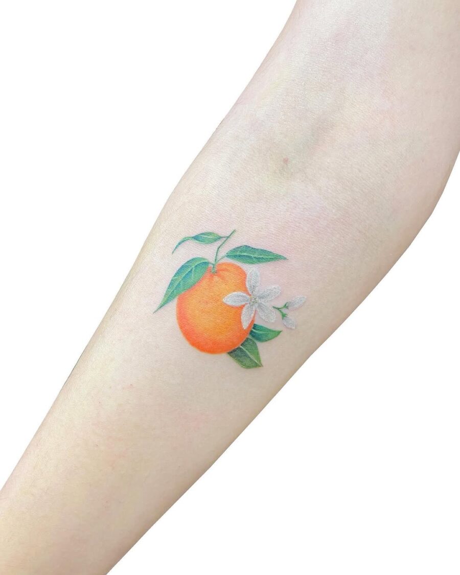 Vibrant orange tattoo with delicate blooms Tattoo on skin