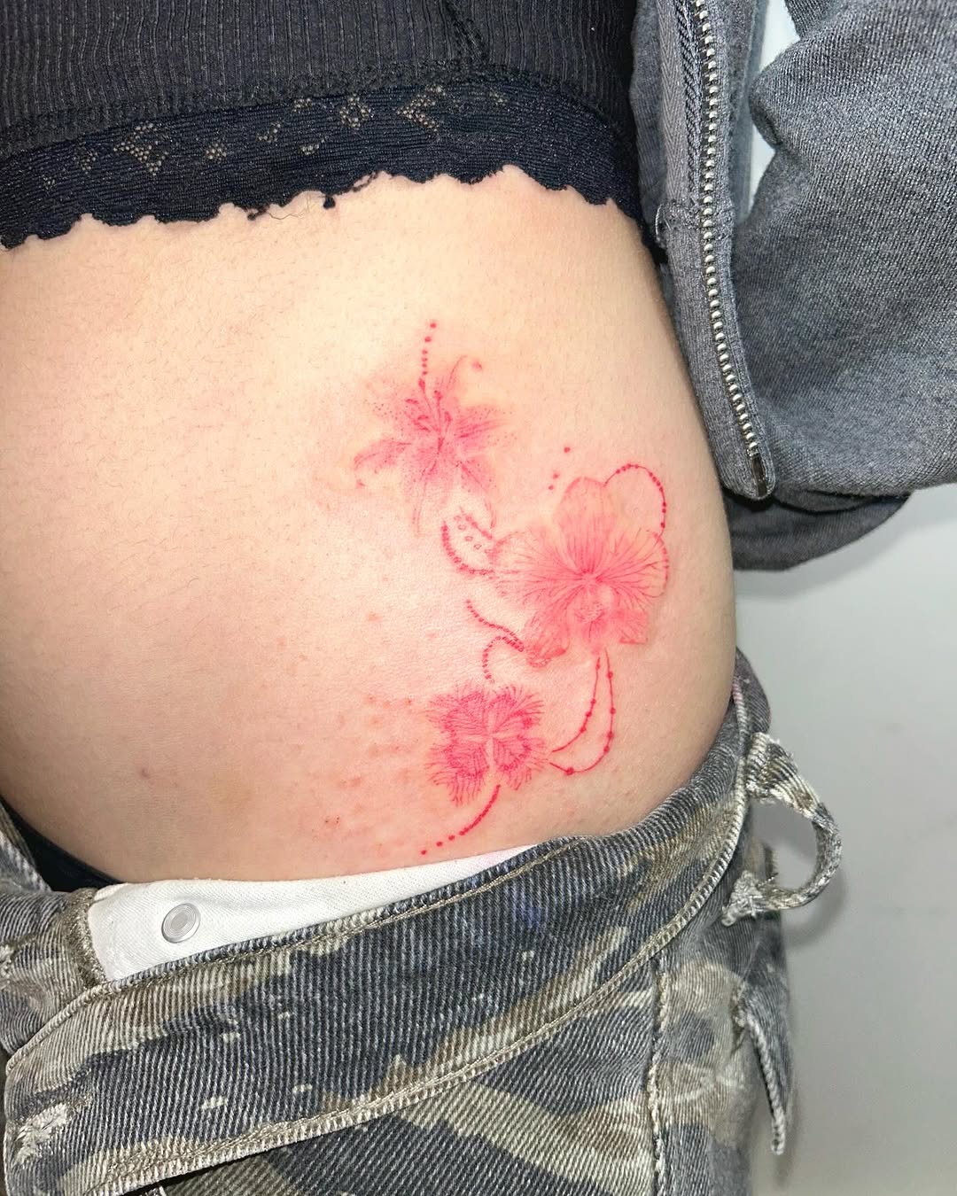 Delicate orchid tattoo with a romantic vibe Tattoo on skin
