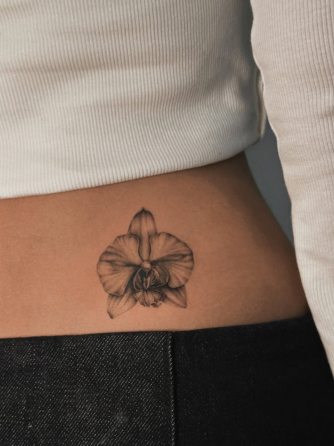 Elegant black and white orchid tattoo design Tattoo on skin