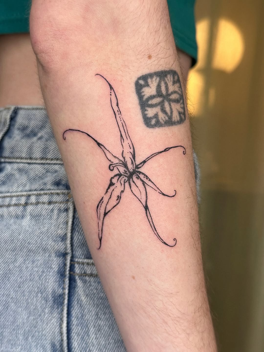 Elegant black outline orchid tattoo design Tattoo on skin