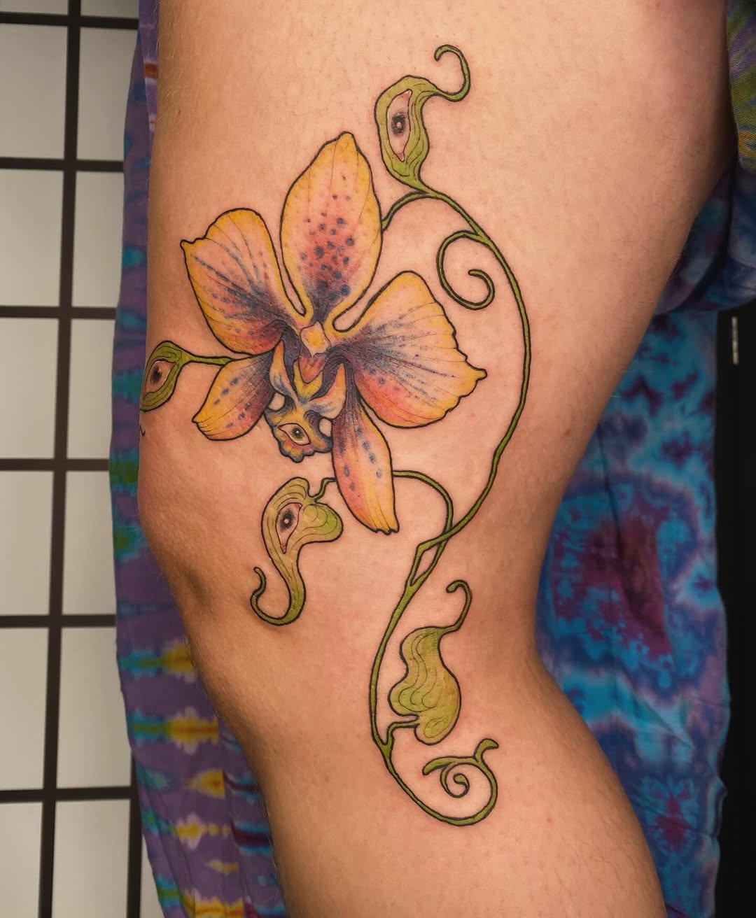 Elegant orchid tattoo design with vibrant colors Tattoo on skin