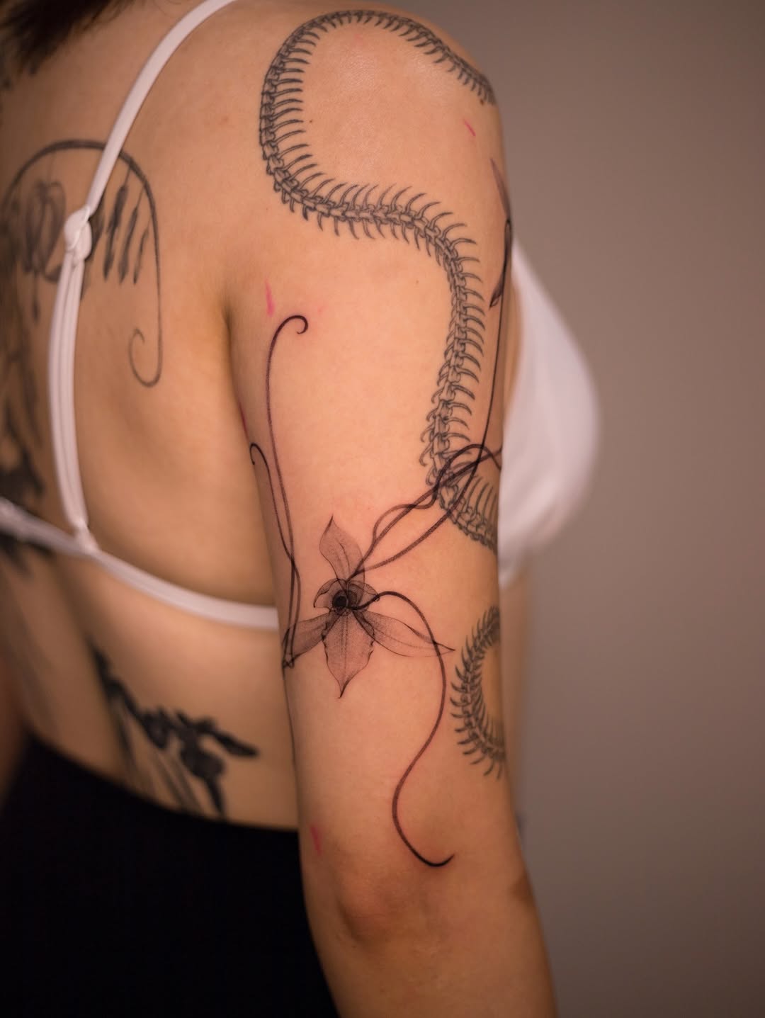 Elegant orchid tattoo with intricate designs Tattoo on skin
