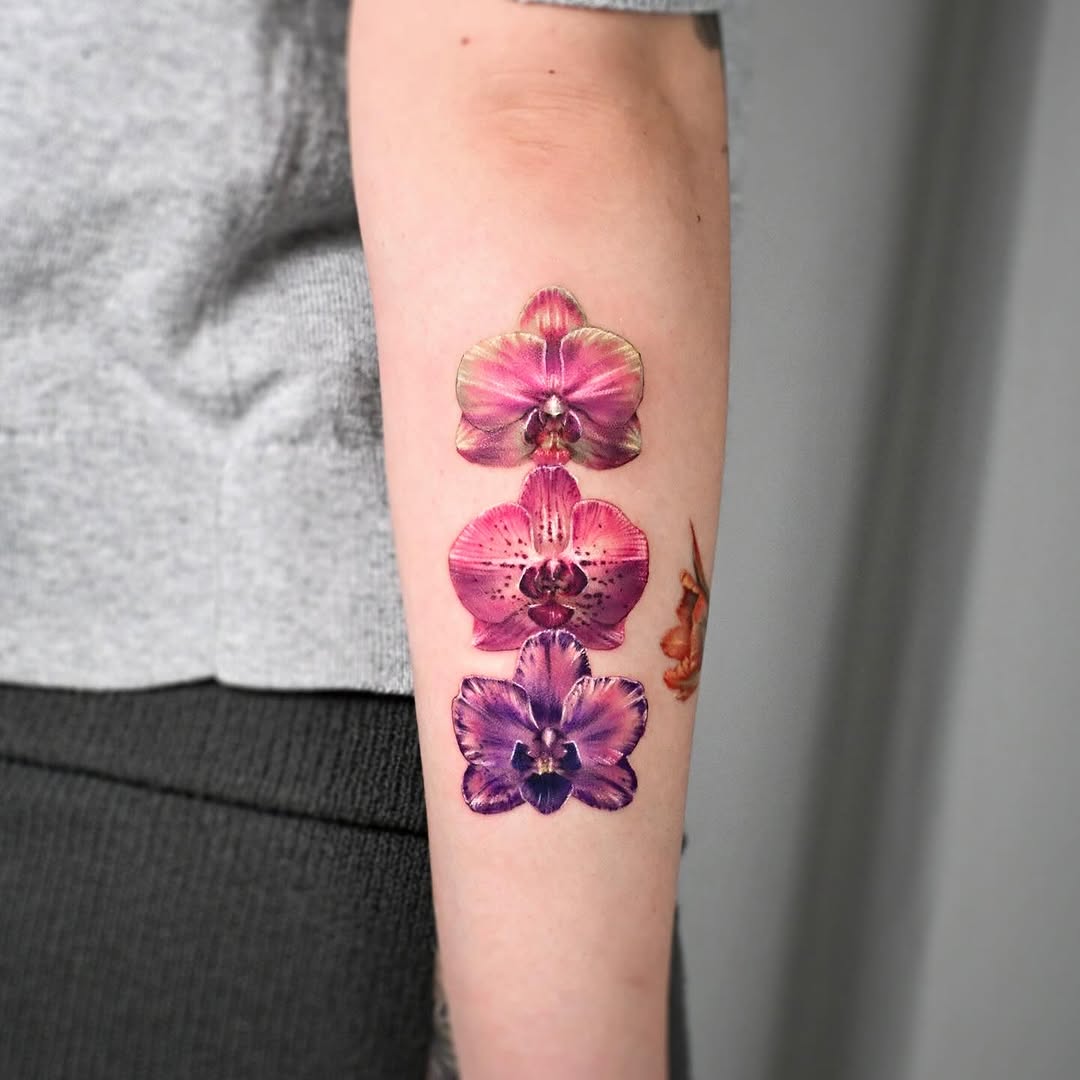Vibrant orchid tattoo showcasing artistic elegance Tattoo on skin