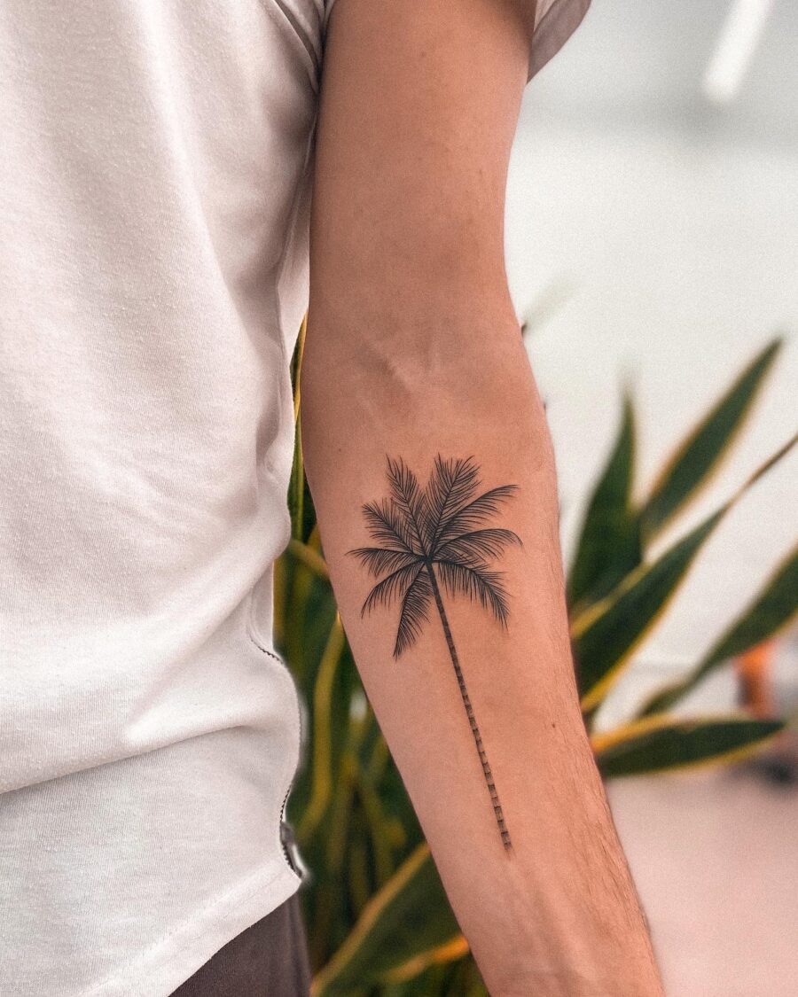 Chic minimalism shines in this palm tree tattoo Tattoo on skin