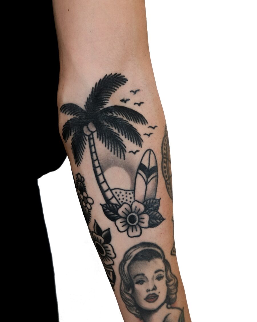 Cool palm tree tattoo with surfboard vibes Tattoo on skin