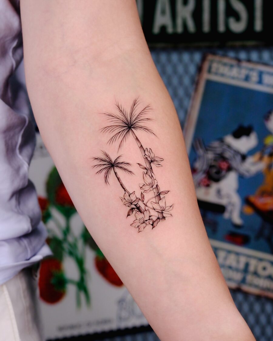Elegant palm tree and floral tattoo design Tattoo on skin