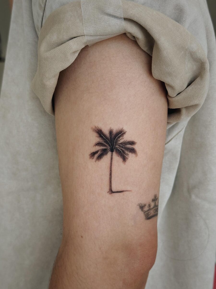 Elegant palm tree tattoo for nature lovers Tattoo on skin