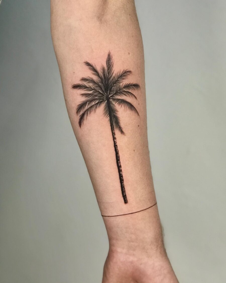Elegant palm tree tattoo on a forearm Tattoo on skin