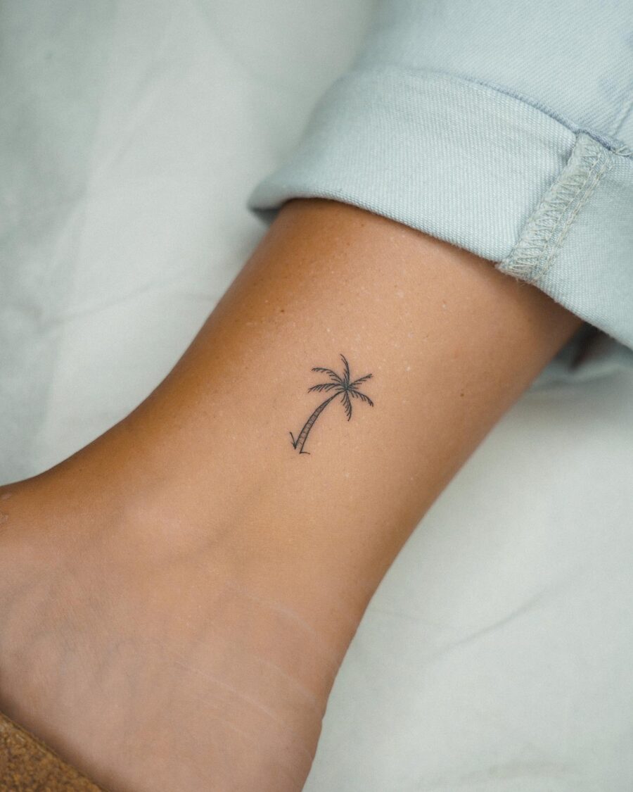 Minimalist palm tree tattoo on ankle Tattoo on skin